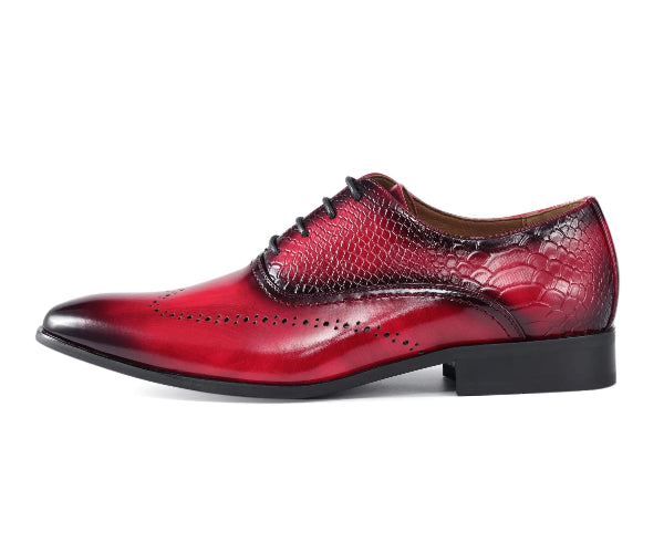 Red leather dress shoe with black sole on a white background
