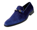 Blue suede loafer with a gold buckle on a white background