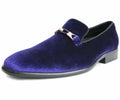 Purple velvet loafer with a gold buckle on a white background