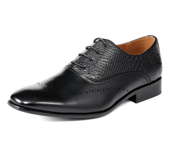 Black leather dress shoe with crocodile texture on a white background